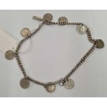 AN ANTIQUE SILVER 2 ROW BRACELET MOUNTED WITH SILVER 3 PENNIES