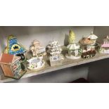 SHELF OF APPROX 12 BONE CHINA & POTTERY COTTAGES, SOME BY COALPORT