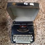 PORTABLE OLYMPIA TYPEWRITER IN CASE