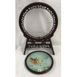 ORIENTAL HARDWOOD CARVED STAND SUPPORTING A CIRCULAR FRAME WITH A MOBILE, DOUBLE-SIDED SILK-WORK