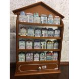 QTY OF 24 SPICE JARS BY BROOKS & BENTLEY WITH DISPLAY SHELF