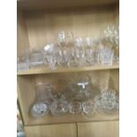 2 SHELVES OF MAINLY CRYSTAL GLASSWARE, INCL; WINE GLASSES, JUGS, BOWLS ETC