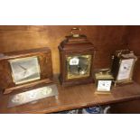 SHELF OF VARIOUS CLOCKS