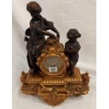 GILT MANTLE CLOCK ADORNED WITH FIGURES