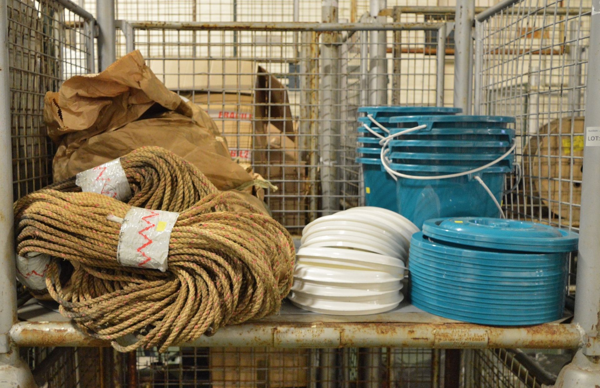 Blue plastic buckets with lids, hessian rope lengths
