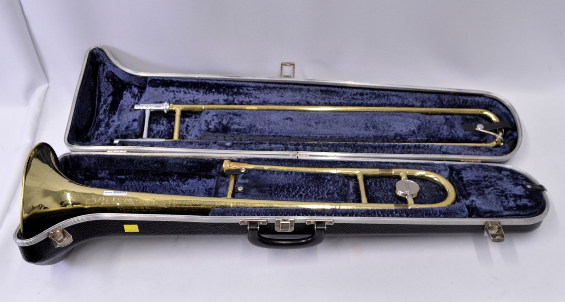 Selmer Bundy Trombone with Case. Obvious dents.
