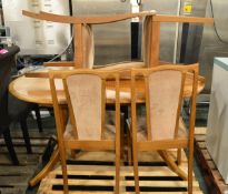 Wooden oval dining table with 4 chairs