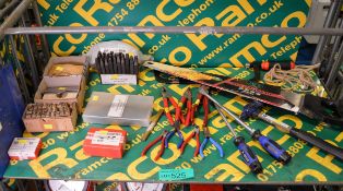 Various hand tools - punches, pliers, hammer, screwdrivers, saws, textile holder