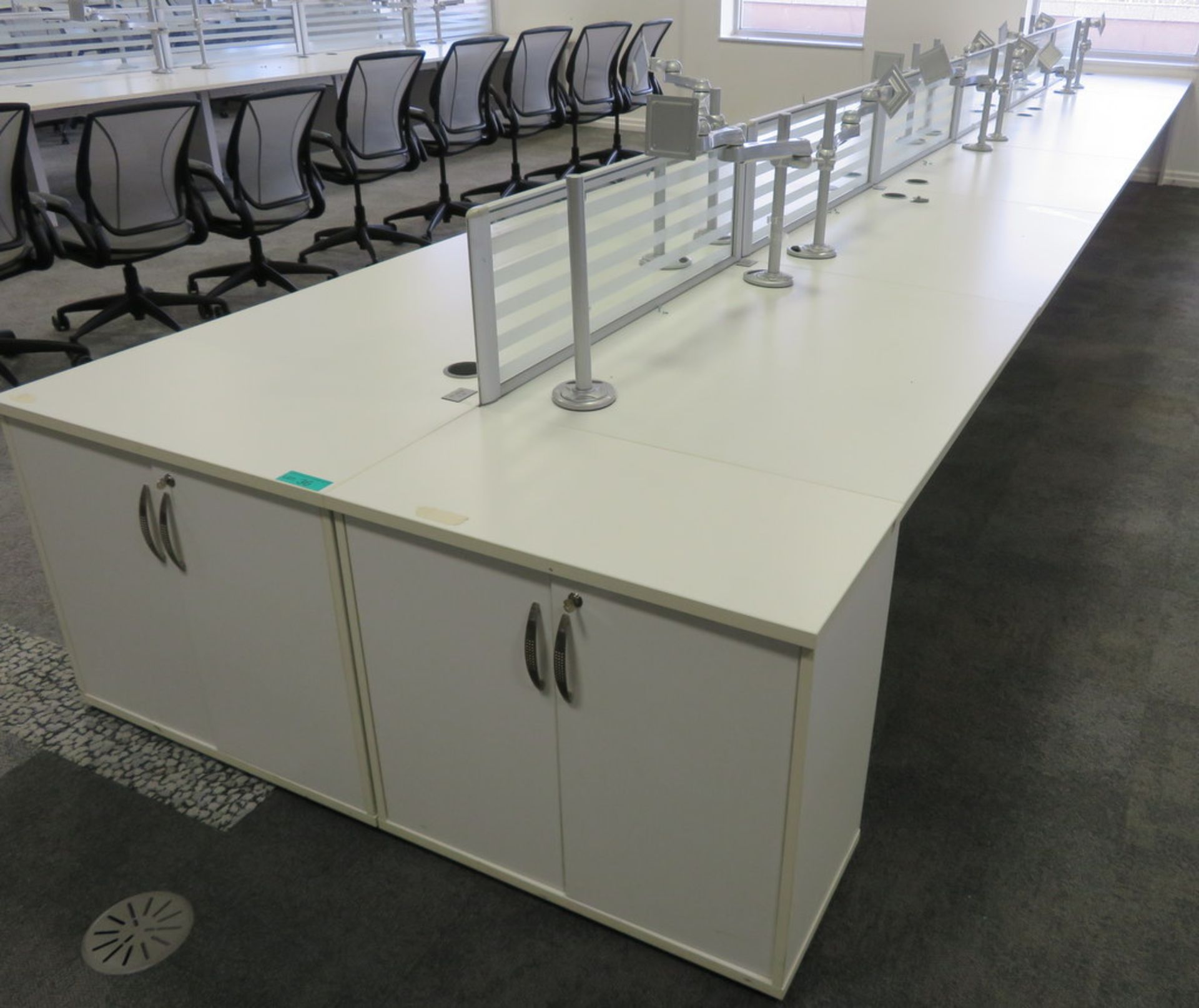 12 Person Desk Arrangement With Dividers, Monitor Arms & Storage Cupboards.