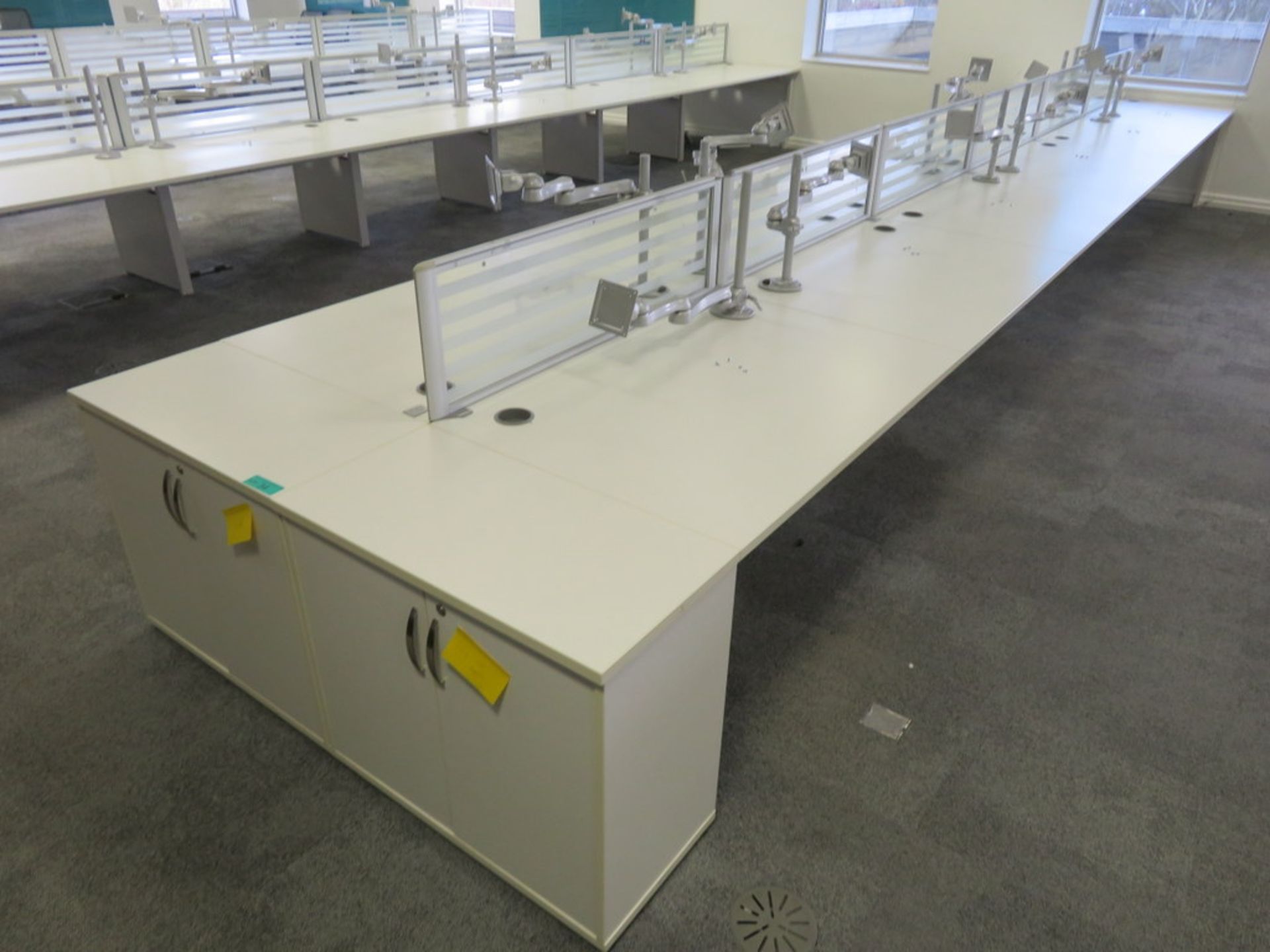 12 Person Desk Arrangement With Dividers, Monitor Arms & Storage Cupboards.