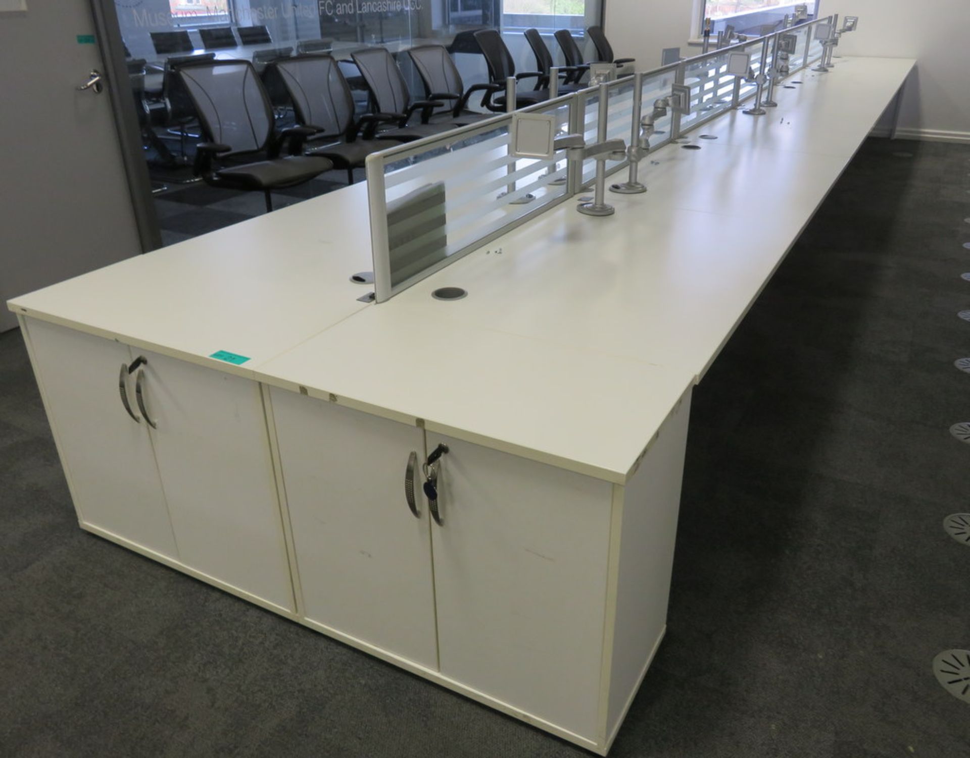 12 Person Desk Arrangement With Dividers, Monitor Arms & Storage Cupboards.