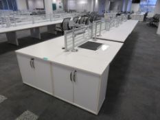 12 Person Desk Arrangement With Dividers, Monitor Arms & Storage Cupboards.