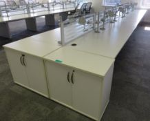 12 Person Desk Arrangement With Dividers, Monitor Arms & Storage Cupboards.