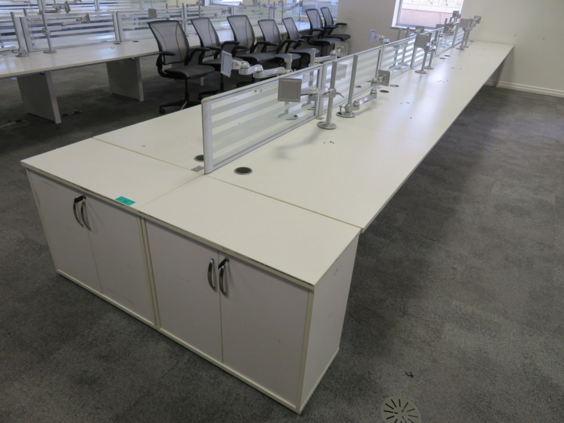 12 Person Desk Arrangement With Dividers, Monitor Arms & Storage Cupboards.