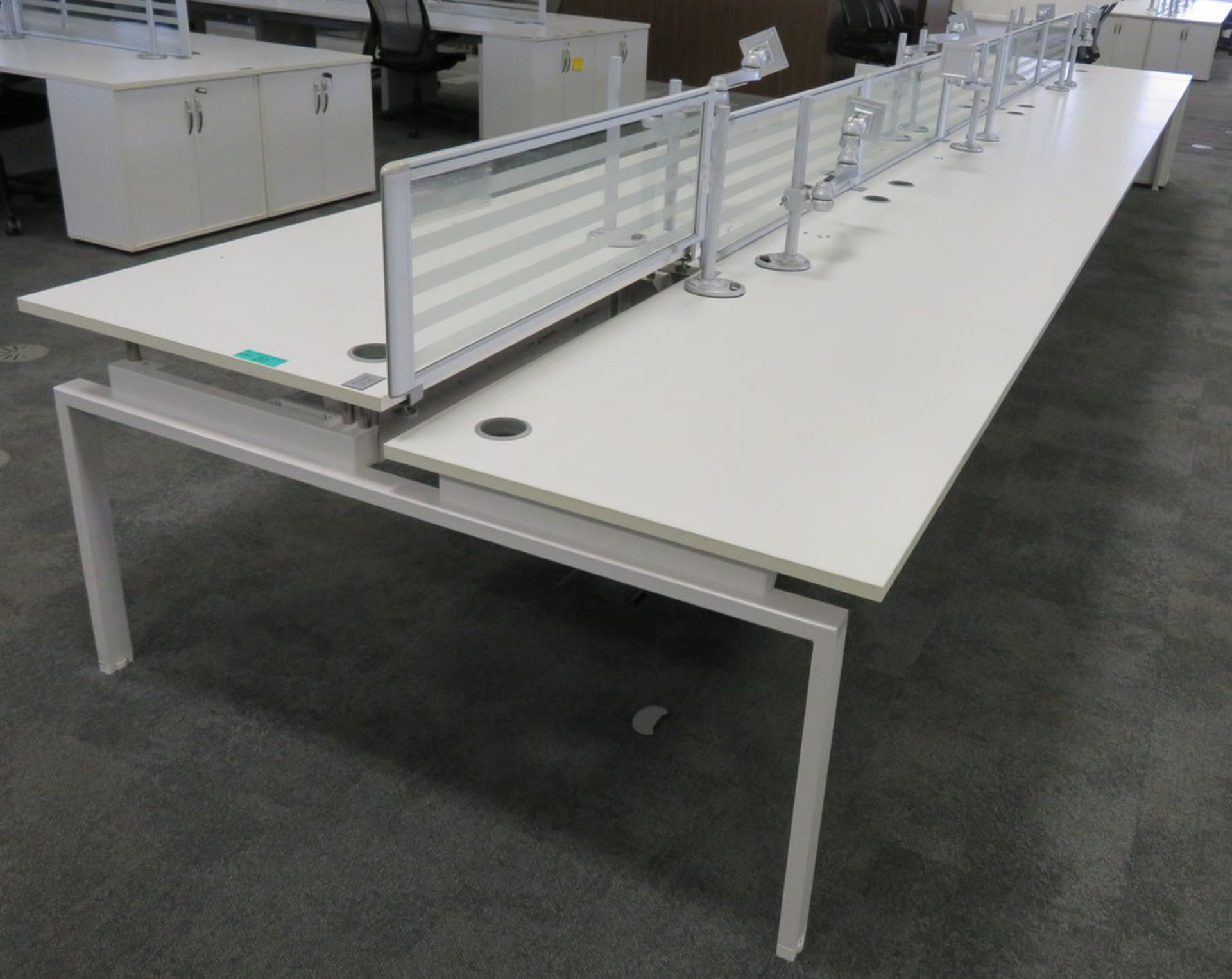 12 Person Desk Arrangement With Dividers, Monitor Arms & Storage Cupboards.