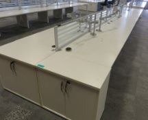 12 Person Desk Arrangement With Dividers, Monitor Arms & Storage Cupboards.