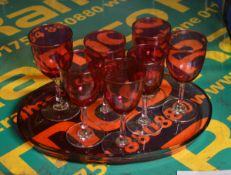 Red Goblet Glasses on Red Glass Tray