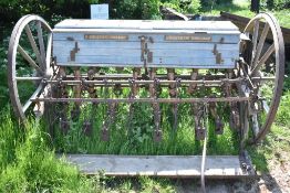 COUTALS, GRANTHAM, ENGLAND. CORN DRILL ON WOODEN WHEELS