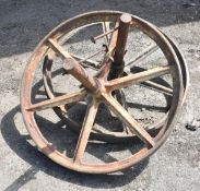 TWO CAST IRON WHEELS WITH AXLE, 33" X 3.5"