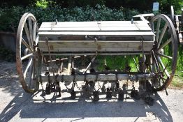 COUTALS, GRANTHAM, ENGLAND. CORN DRILL ON WOODEN WHEELS