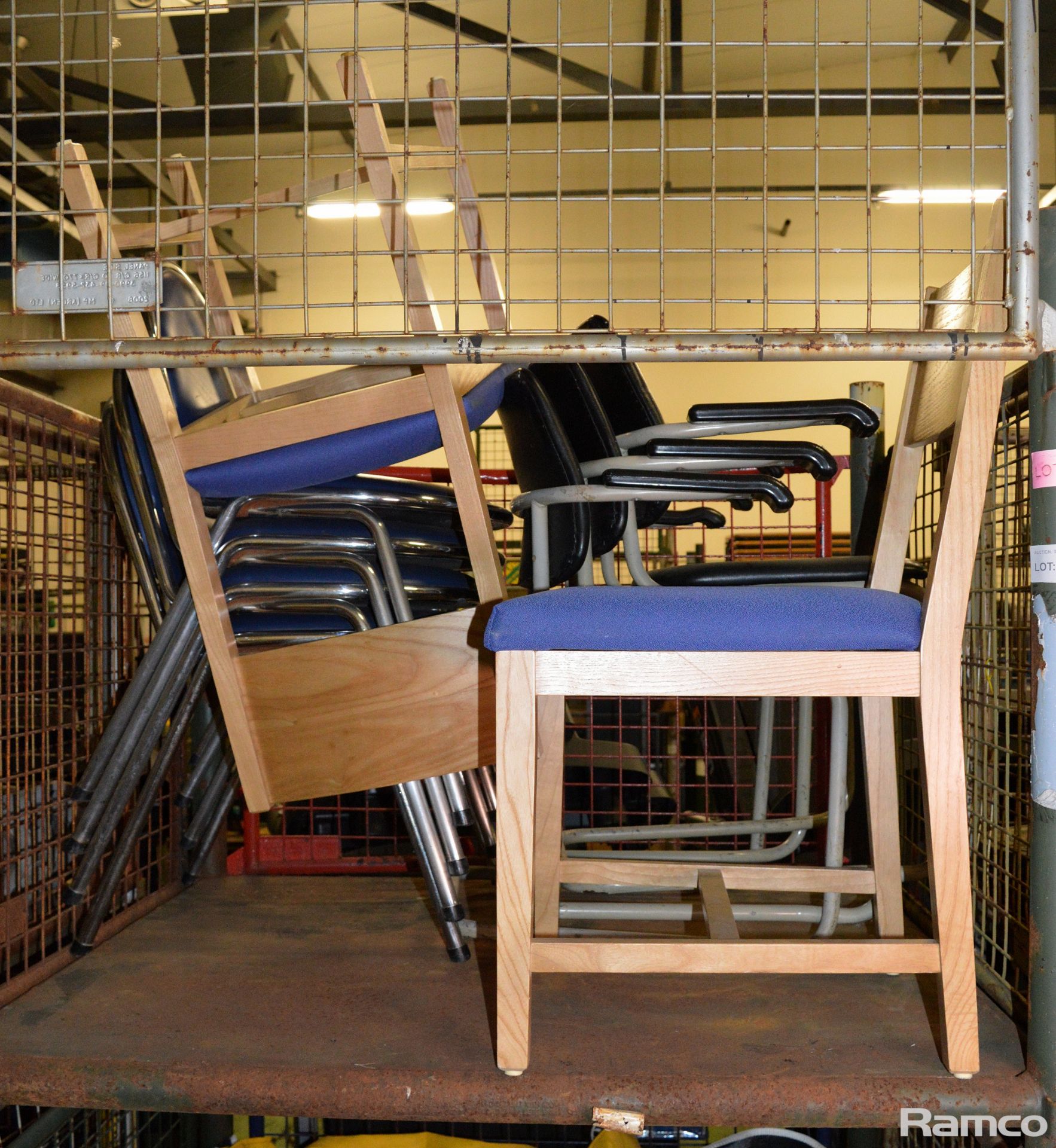 2x Reception blue fabric chairs, 7x Metal legged black cushion chairs