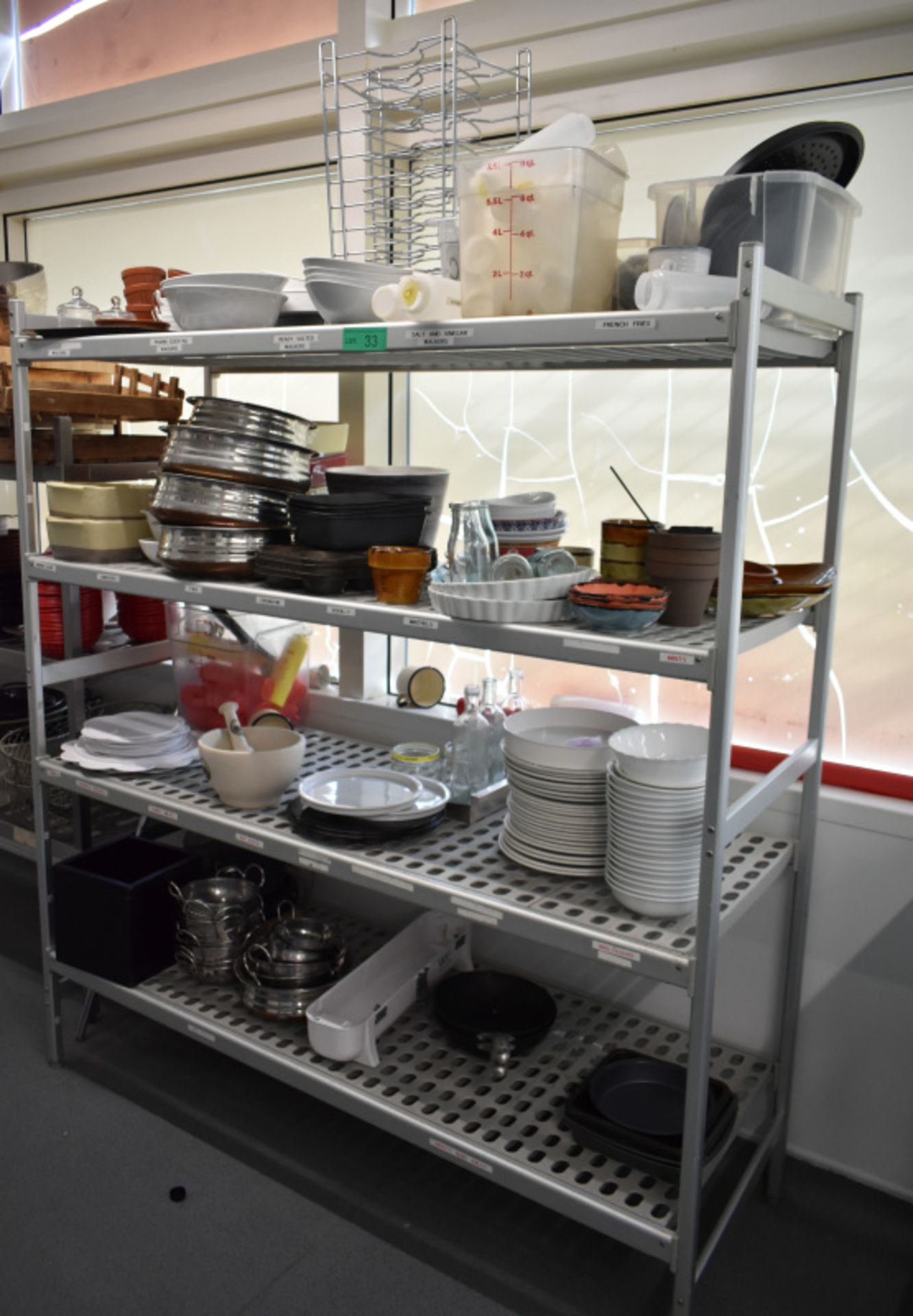 Four tier kitchen storage rack with contents, contents to include- pestle and mortar, plat