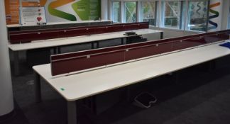 Bank of desks, seating 12, L 6500mm x W 1800mm x H 1180mm, buyer to dismantle and remove