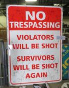 No trespassing' tin sign