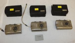 3x Canon IXUS 960 IS digital cameras - 1x battery, no memory cards