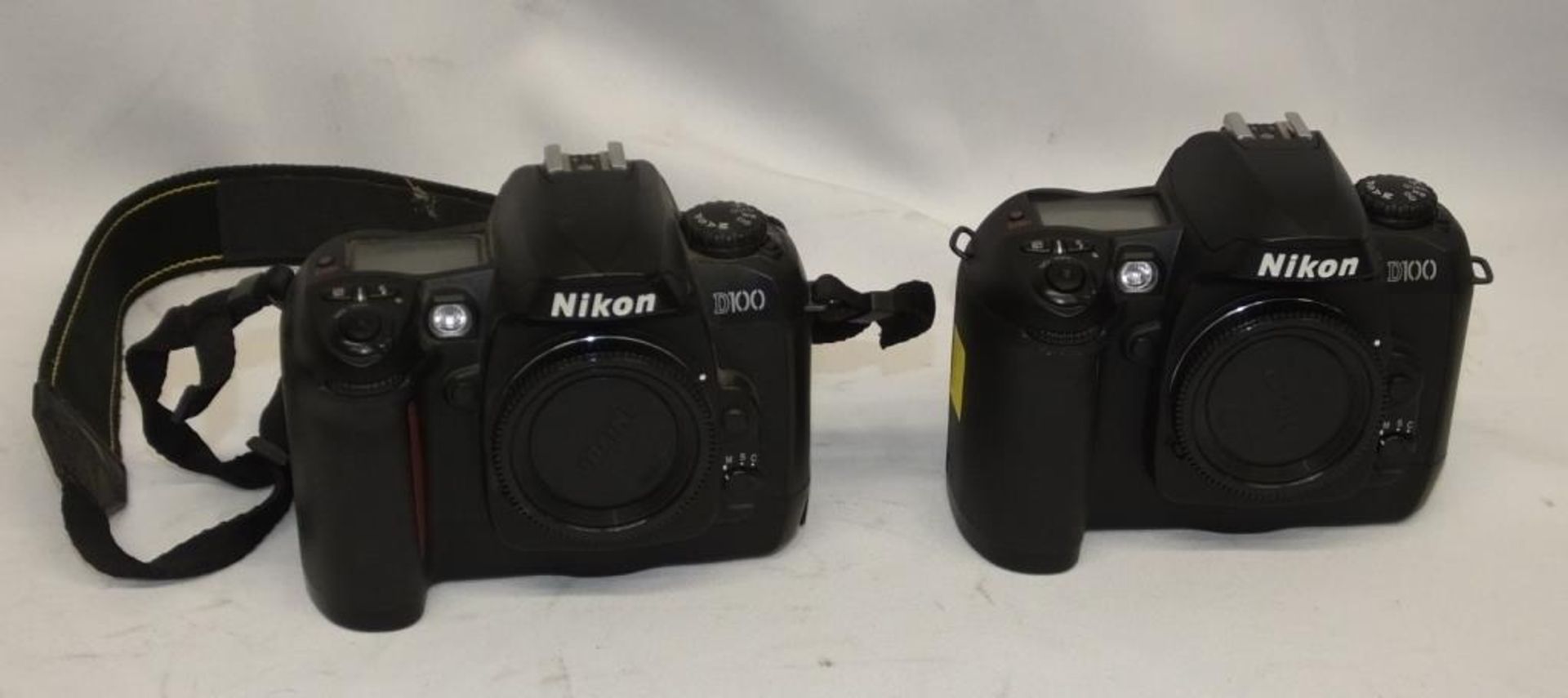 2x Nikon D100 camera bodies - serials 2269690, 2290444 - no batteries, no memory cards