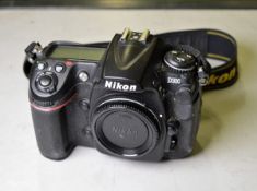 Nikon D300 camera body, no battery, no memory card, 1 battery charger, manual