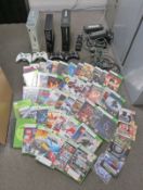 3x Xbox 360 games consoles, 4 controllers (missing joystick on one), charging dock for con