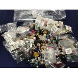 A bag containing a large quantity of earrings, pendants etc. (a lot)