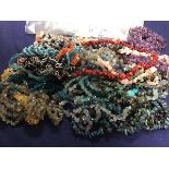 A mixed lot of glass, polished stone and coral bead necklaces (a lot)