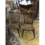 A pair of Victorian elm spar back kitchen chairs, each with shaped saddle seat. h. 84cm, w. 37cm