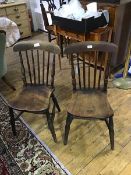 A pair of Victorian elm spar back kitchen chairs, each with shaped saddle seat. h. 84cm, w. 37cm