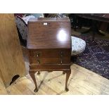 An early 20thc mahogany bureau, the plain rectangular top above a fall front enclosing a fitted