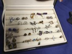 A ring box containing a mixed lot of pendent and stud earrings, various metals (a lot)