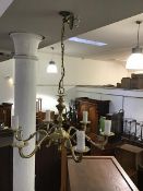 A suite of three brass hanging chandeliers in the Edwardian style, two five arm and one three arm,