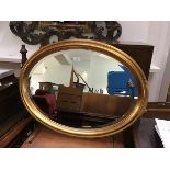 An Edwardian style gilt framed wall mirror with bevelled glass plate (60cm x 80cm)