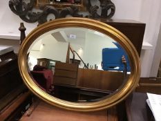 An Edwardian style gilt framed wall mirror with bevelled glass plate (60cm x 80cm)