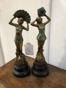 An Art Deco pair of painted spelter Art Deco dancing figures, on bakelite stands (h.34cm)