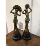 An Art Deco pair of painted spelter Art Deco dancing figures, on bakelite stands (h.34cm)