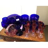A suite of Bristol blue glassware including six wine glasses, eight bowls and eight plates