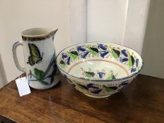 A creamware bowl, possibly Scottish, early 19thc. painted to the well, rim and exterior with