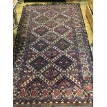 A Turkoman rug, the Madderfield allover decorated with four conjoined ivory medallions including