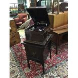 A Columbia table top gramophone in mahogany case, the sarcophagus shaped top on rectangular base,