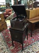 A Columbia table top gramophone in mahogany case, the sarcophagus shaped top on rectangular base,