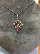 An Edwardian 9ct gold aquamarine pendant on a tracelink chain
