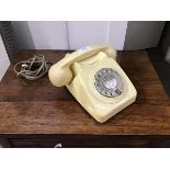 A 1970's/80's British Telecom ivory coloured phone fitted with modern connector